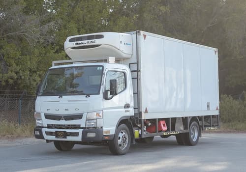 Used 2022 Mitsubishi Canter Chiller Box in White – Left Front Diagonal (45°) View for Sale at First Choice Cars Dubai Sharjah