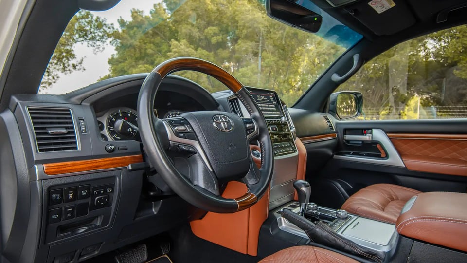 Used 2016 Toyota Land Cruiser GXR in White – Driver Side Dashboard & Steering View for Sale at First Choice Cars Dubai Sharjah