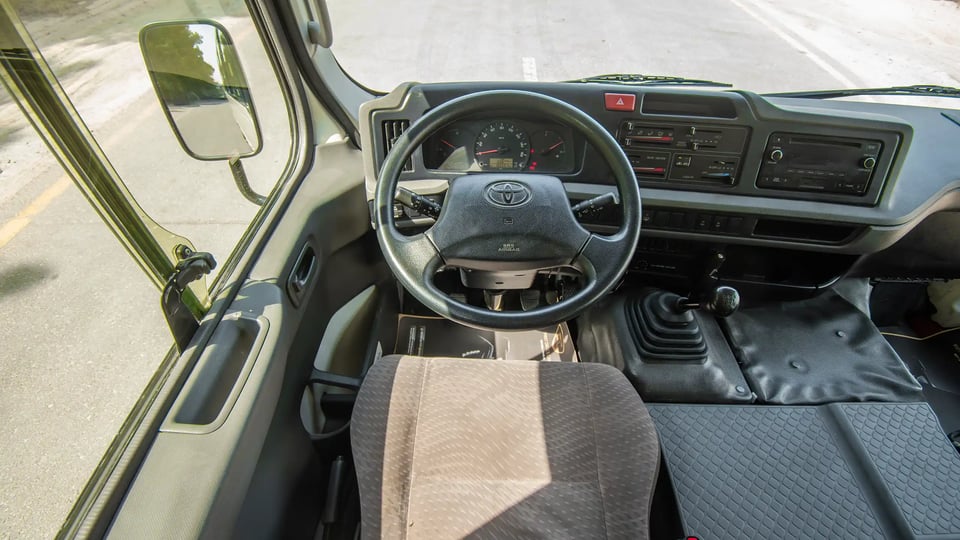 Used 2020 Toyota Coaster Bus in White – Steering Wheel & Instrument Cluster for Sale at First Choice Cars Dubai Sharjah