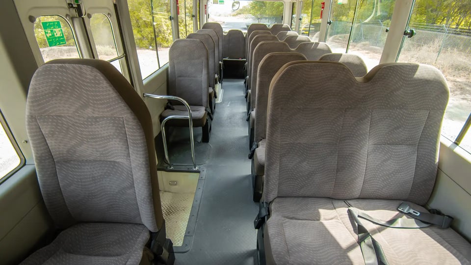 Used 2020 Toyota Coaster Bus in White – Rear Seat View for Sale at First Choice Cars Dubai Sharjah