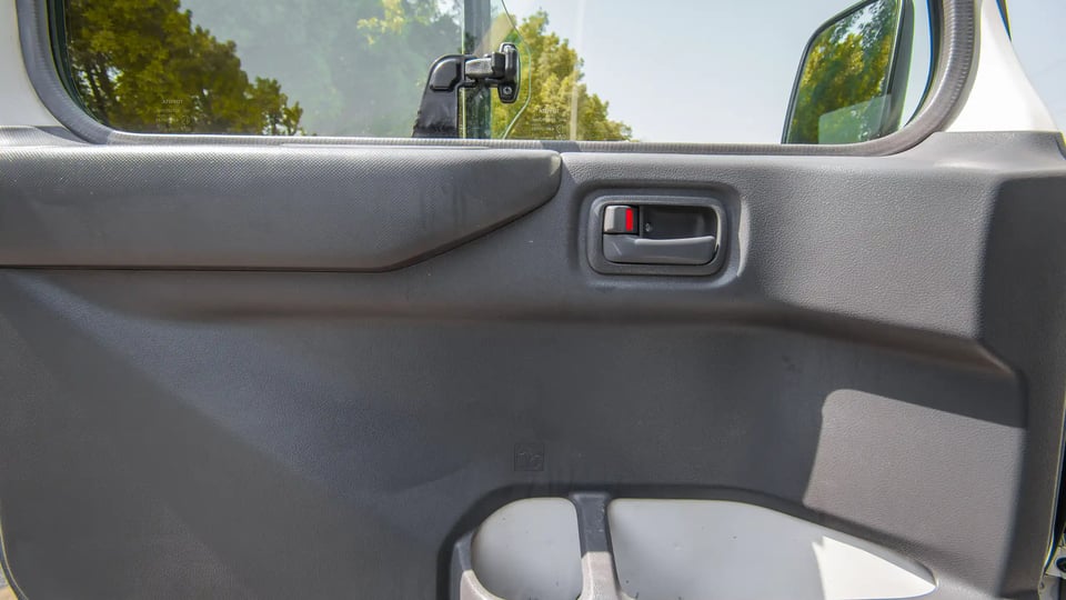 Used 2020 Toyota Coaster Bus in White – Driver Door Panel Full View for Sale at First Choice Cars Dubai Sharjah