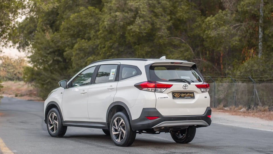 Used 2023 Toyota Rush EX in White – Left Back Diagonal (45°) View for Sale at First Choice Cars Dubai Sharjah