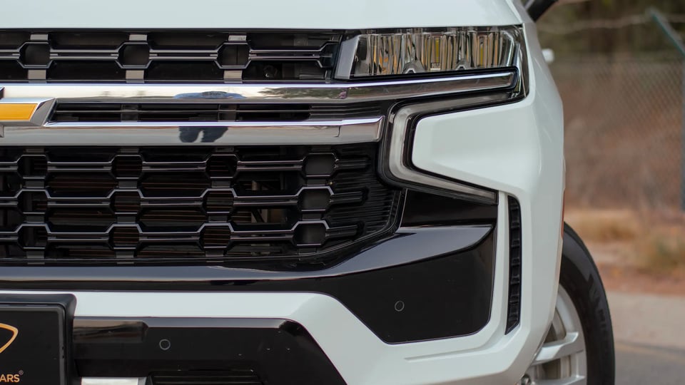 Used 2023 Chevrolet Tahoe LS in White – Headlight Close-up for Sale at First Choice Cars Dubai Sharjah