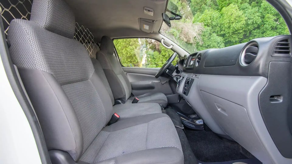 Used 2022 Nissan Urvan Standard Roof White – Front Passenger Side Cabin View at First Choice Cars Sharjah