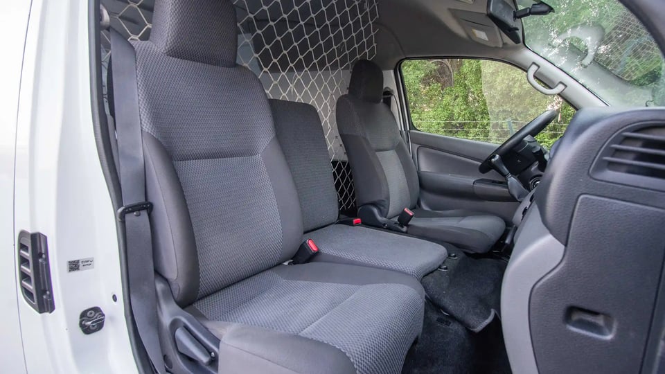 Used 2022 Nissan Urvan High Roof in White – Front Passenger Side Cabin View for Sale at First Choice Cars Dubai Sharjah