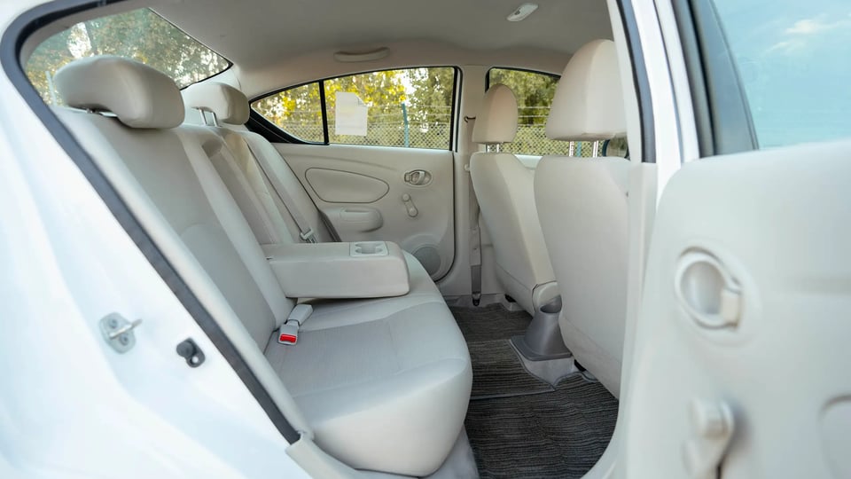 Used 2022 Nissan Sunny SV in White – Rear Passenger Side Cabin View for Sale at First Choice Cars Dubai Sharjah