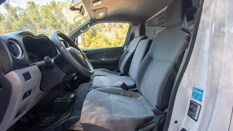 Used 2021 Nissan Urvan Standard Roof in White – Front Driver Side Cabin View for Sale at First Choice Cars Dubai Sharjah