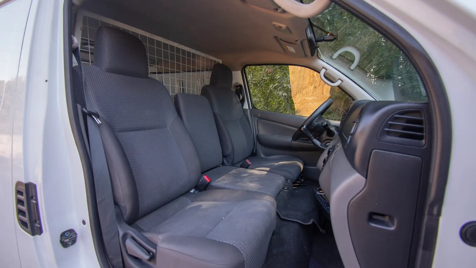 Used 2021 Nissan Urvan Standard Roof in White – Front Passenger Side Cabin View for Sale at First Choice Cars Dubai Sharjah