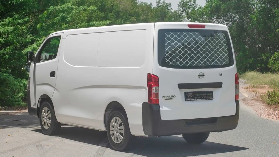 Used 2021 Nissan Urvan Standard Roof in White – Left Back Diagonal (45°) View for Sale at First Choice Cars Dubai Sharjah
