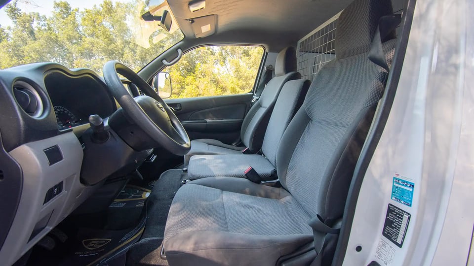 Used 2021 Nissan Urvan Standard Roof in White – Front Driver Side Cabin View for Sale at First Choice Cars Dubai Sharjah