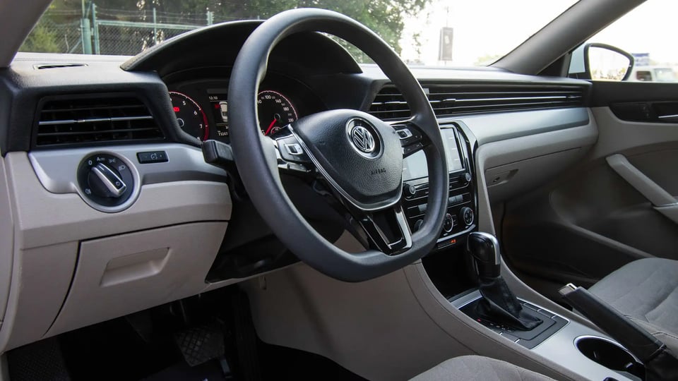 Used 2020 Volkswagen Passat Trendline in White – Driver Side Dashboard & Steering View for Sale at First Choice Cars Dubai Sharjah
