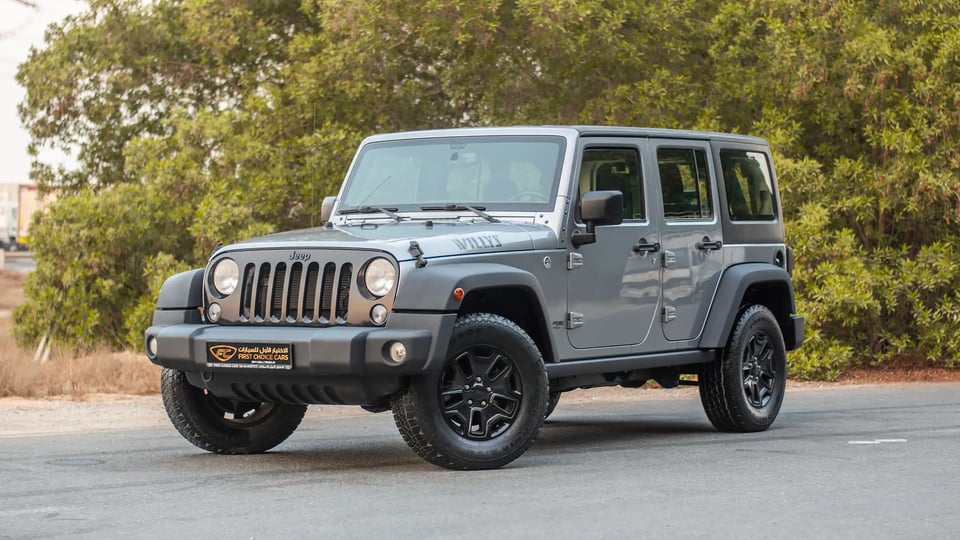 Used 2018 Jeep Wrangler Unlimited Willys Wheeler in Silver – Left Front Diagonal (45°) View for Sale at First Choice Cars Dubai Sharjah