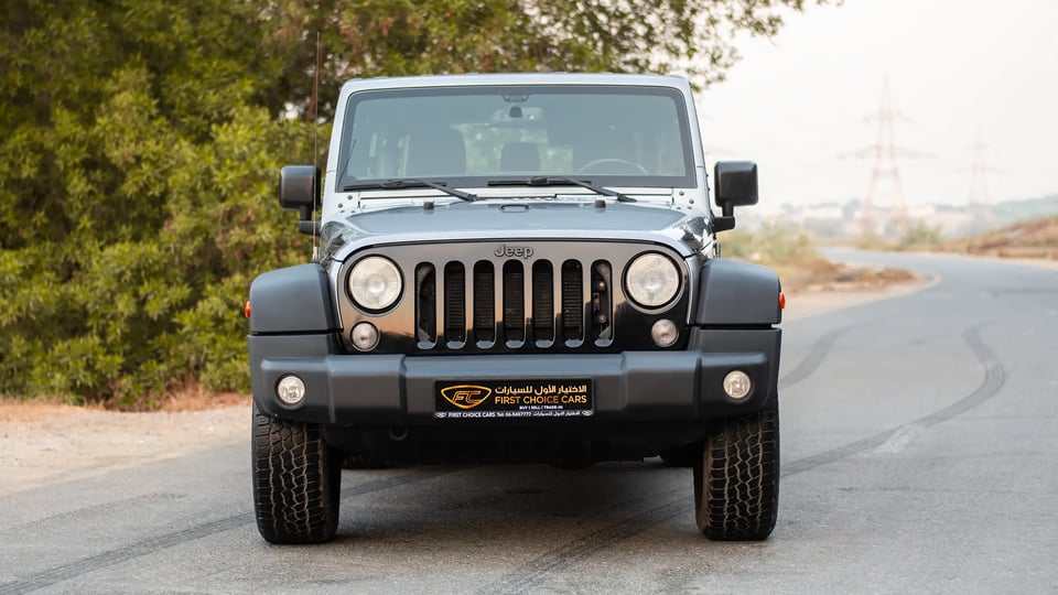 Used 2018 Jeep Wrangler Unlimited Willys Wheeler in Silver – Front View for Sale at First Choice Cars Dubai Sharjah