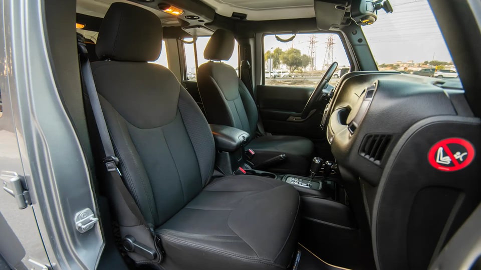 Used 2018 Jeep Wrangler Unlimited Willys Wheeler in Silver – Front Passenger Side Cabin View for Sale at First Choice Cars Dubai Sharjah