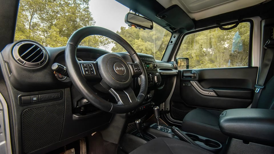 Used 2018 Jeep Wrangler Unlimited Willys Wheeler in Silver – Driver Side Dashboard & Steering View for Sale at First Choice Cars Dubai Sharjah