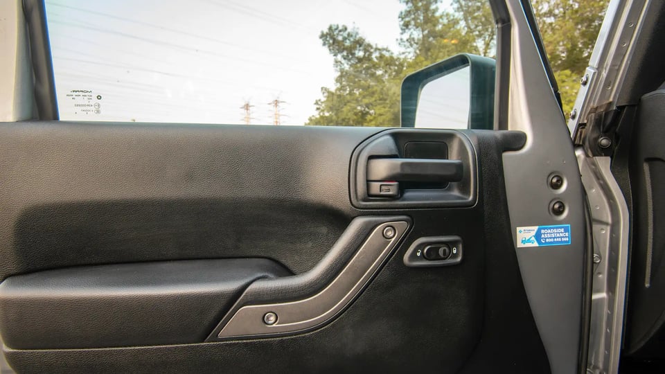 Used 2018 Jeep Wrangler Unlimited Willys Wheeler in Silver – Driver Door Panel Full View for Sale at First Choice Cars Dubai Sharjah