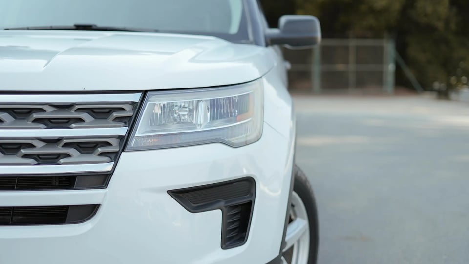 Used 2018 Ford Explorer XLT White – Headlight Close-up at First Choice Cars Sharjah