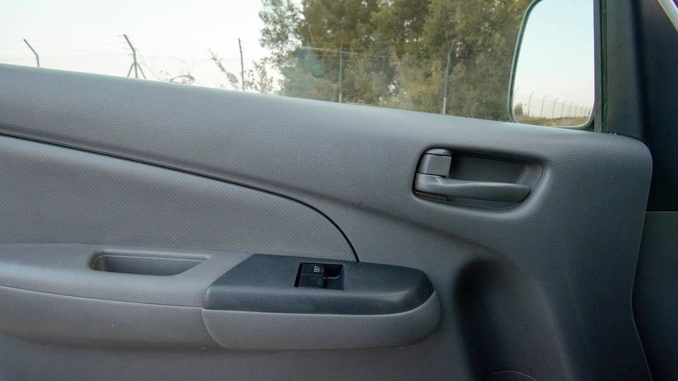 Used 2016 Nissan Urvan Standard Roof in White – Driver Door Panel Full View for Sale at First Choice Cars Dubai Sharjah