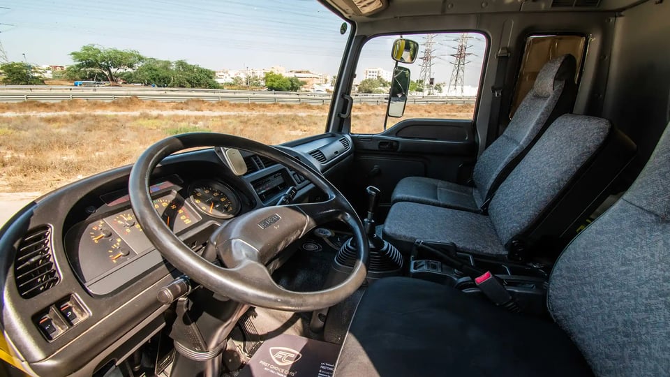 Used 2016 Isuzu FSR Cargo Body in Yellow – Driver Side Dashboard & Steering View for Sale at First Choice Cars Dubai Sharjah