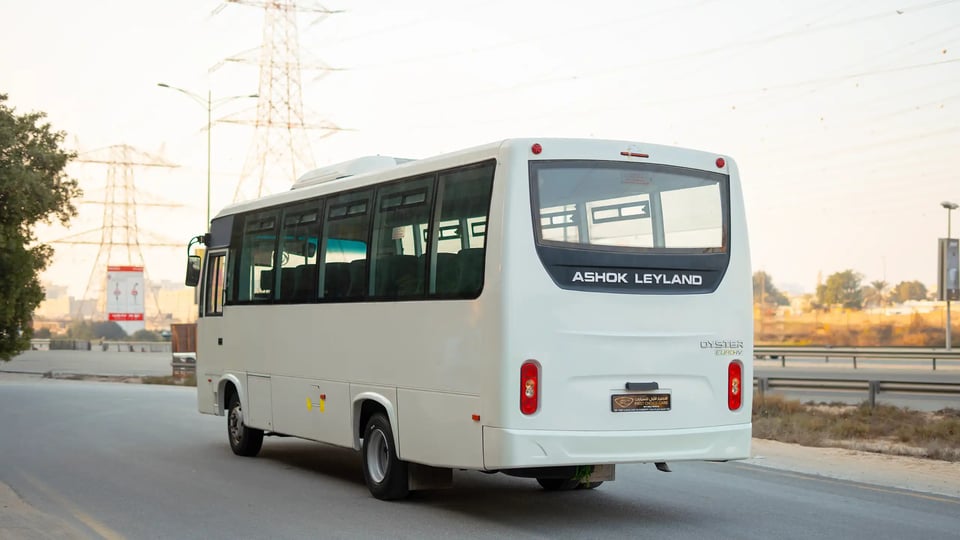 Used 2022 Ashok Leyland Oyster Bus in White – Left Back Diagonal (45°) View for Sale at First Choice Cars Dubai Sharjah