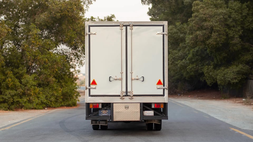 Used 2016 Isuzu NPR Freezer Box in White – Back/Rear View for Sale at First Choice Cars Dubai Sharjah