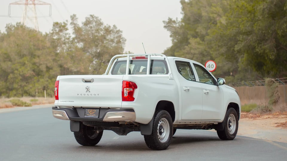 Used 2023 Peugeot Landtrek Double Cabin in White – Right Back Diagonal (45°) View for Sale at First Choice Cars Dubai Sharjah