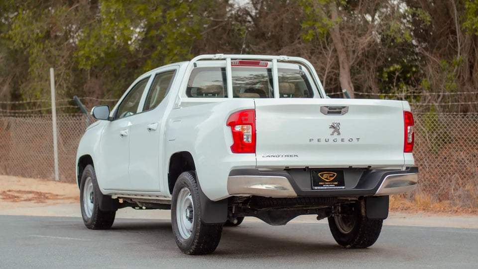 Used 2023 Peugeot Landtrek Double Cabin in White – Left Back Diagonal (45°) View for Sale at First Choice Cars Dubai Sharjah