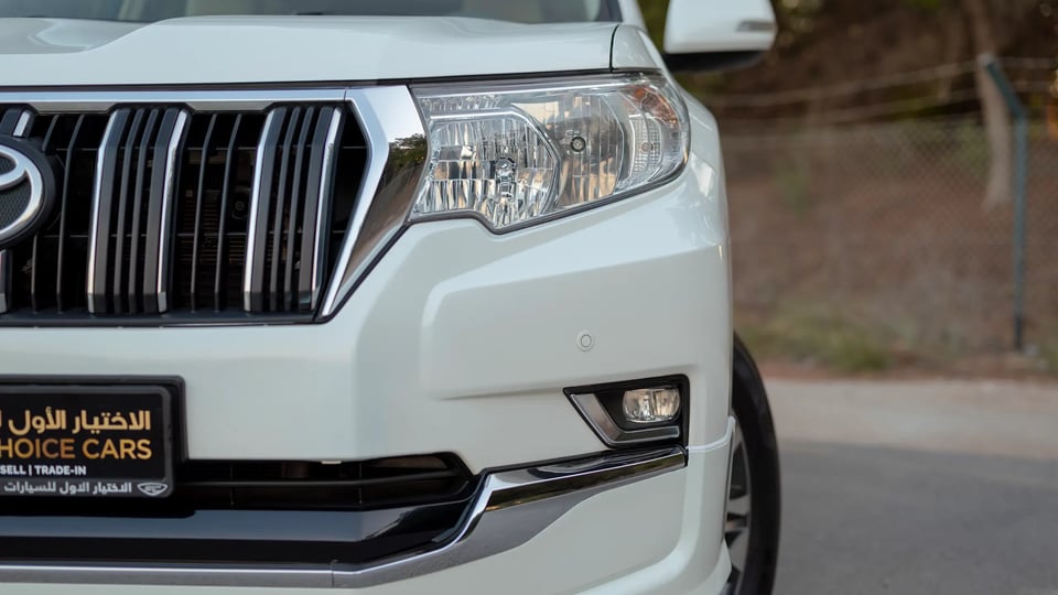 Used 2022 Toyota Prado GXR in White – Headlight Close-up for Sale at First Choice Cars Dubai Sharjah