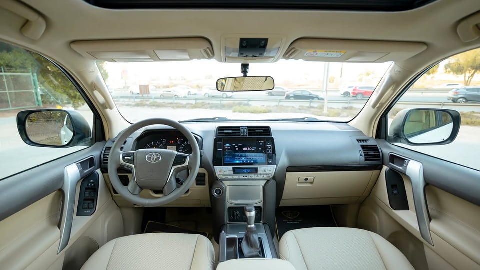 Used 2022 Toyota Prado GXR in White – Front Cabin / Dashboard Full View for Sale at First Choice Cars Dubai Sharjah
