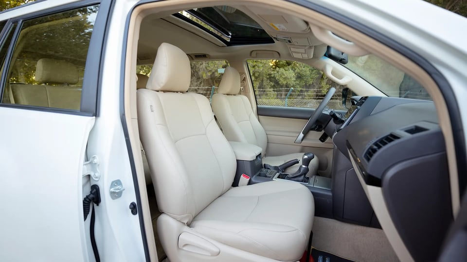 Used 2022 Toyota Prado GXR in White – Front Passenger Side Cabin View for Sale at First Choice Cars Dubai Sharjah