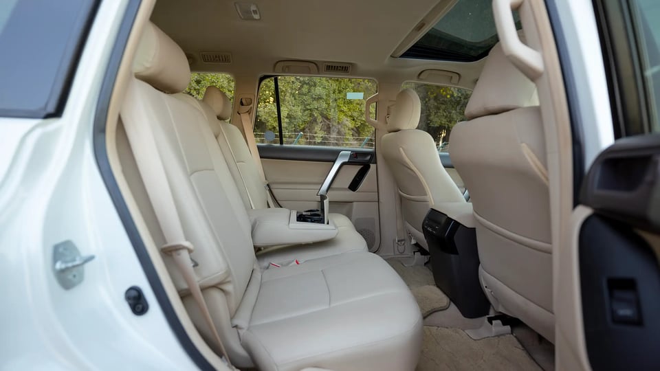 Used 2022 Toyota Prado GXR in White – Rear Passenger Side Cabin View for Sale at First Choice Cars Dubai Sharjah