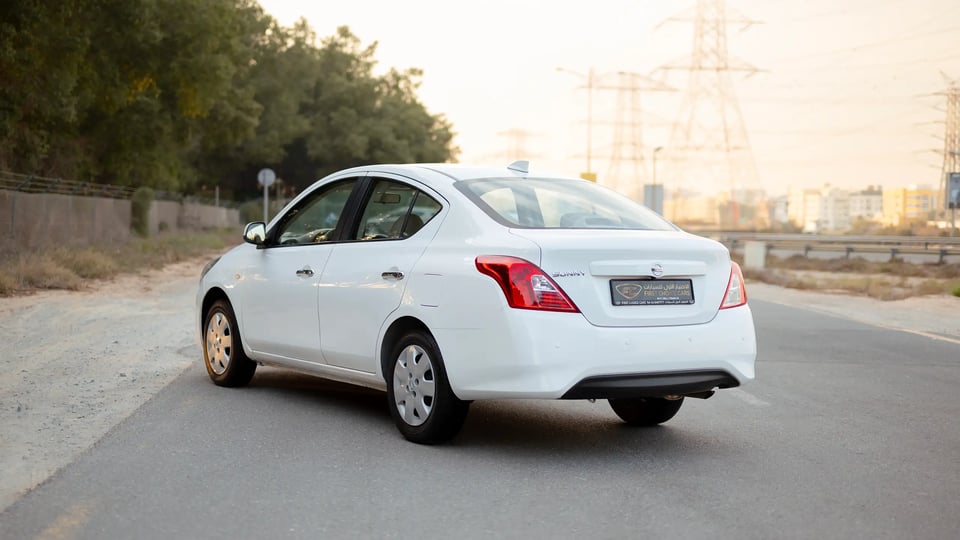 Used 2024 Nissan Sunny SV in White – Left Back Diagonal (45°) View for Sale at First Choice Cars Dubai Sharjah