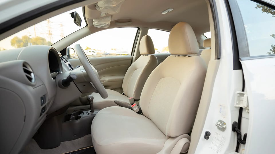 Used 2024 Nissan Sunny SV in White – Front Driver Side Cabin View for Sale at First Choice Cars Dubai Sharjah