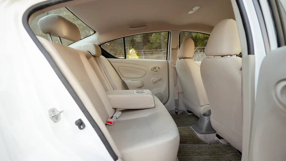 Used 2024 Nissan Sunny SV in White – Rear Passenger Side Cabin View for Sale at First Choice Cars Dubai Sharjah