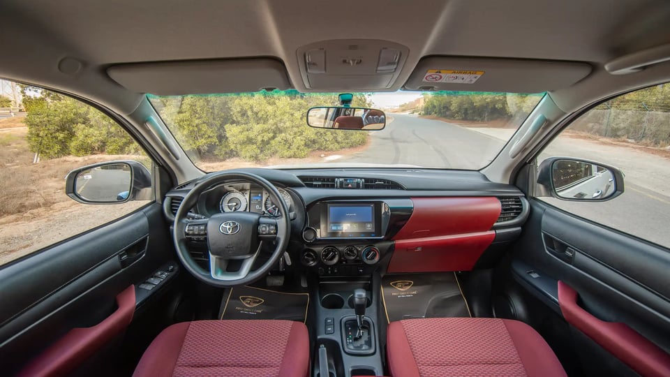 Used 2024 Toyota Hilux DLX Double Cabin in White – Front Cabin / Dashboard Full View for Sale at First Choice Cars Dubai Sharjah