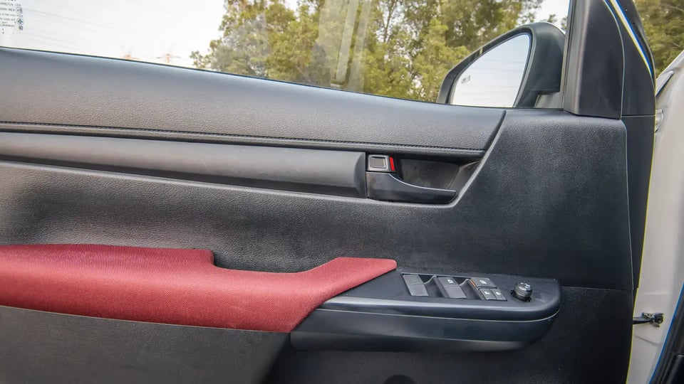 Used 2024 Toyota Hilux DLX Double Cabin in White – Driver Door Panel Full View for Sale at First Choice Cars Dubai Sharjah