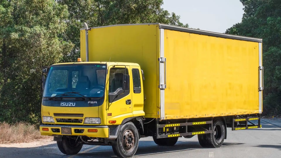 Used 2016 Isuzu FSR Cargo Body in Yellow – Left Front Diagonal (45°) View for Sale at First Choice Cars Dubai Sharjah