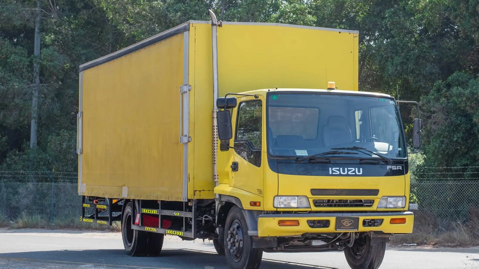 Used 2016 Isuzu FSR Cargo Body in Yellow – Right Front Diagonal (45°) View for Sale at First Choice Cars Dubai Sharjah