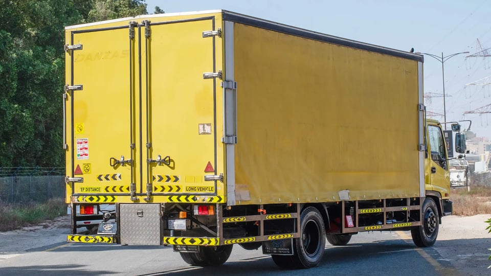 Used 2016 Isuzu FSR Cargo Body in Yellow – Right Back Diagonal (45°) View for Sale at First Choice Cars Dubai Sharjah