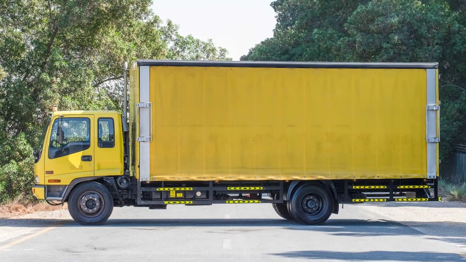 Used 2016 Isuzu FSR Cargo Body in Yellow – Left Back Diagonal (45°) View for Sale at First Choice Cars Dubai Sharjah
