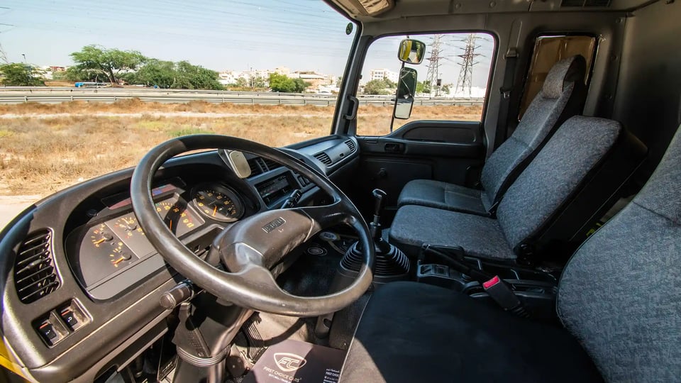 Used 2016 Isuzu FSR Cargo Body in Yellow – Driver Side Dashboard & Steering View for Sale at First Choice Cars Dubai Sharjah