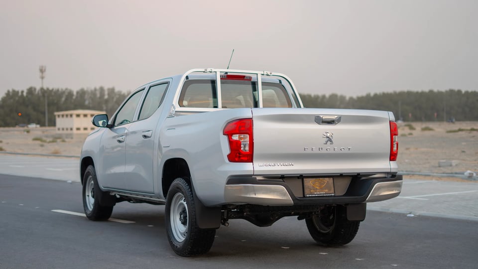 Used 2023 Peugeot Landtrek Double Cabin in Silver – Left Back Diagonal (45°) View for Sale at First Choice Cars Dubai Sharjah