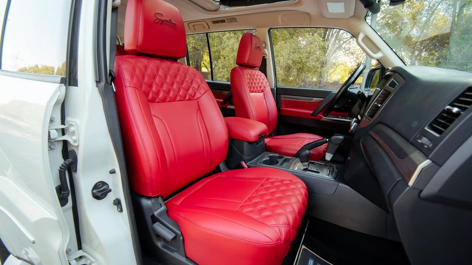 Used 2022 Mitsubishi Pajero GLS in White – Front Passenger Side Cabin View for Sale at First Choice Cars Dubai Sharjah