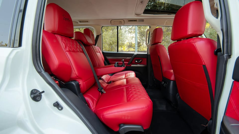 Used 2022 Mitsubishi Pajero GLS in White – Rear Driver Side Cabin View for Sale at First Choice Cars Dubai Sharjah