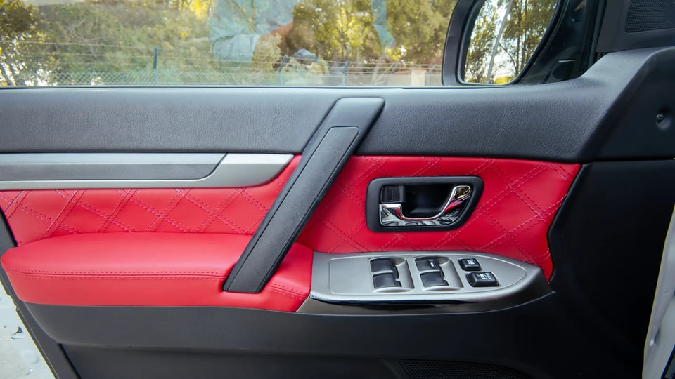 Used 2022 Mitsubishi Pajero GLS in White – Driver Door Panel Full View for Sale at First Choice Cars Dubai Sharjah