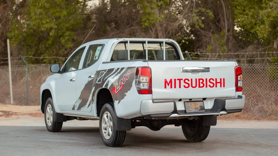 Used 2020 Mitsubishi L200 GLX Double Cabin White – Left Back Diagonal (45°) View at First Choice Cars Sharjah