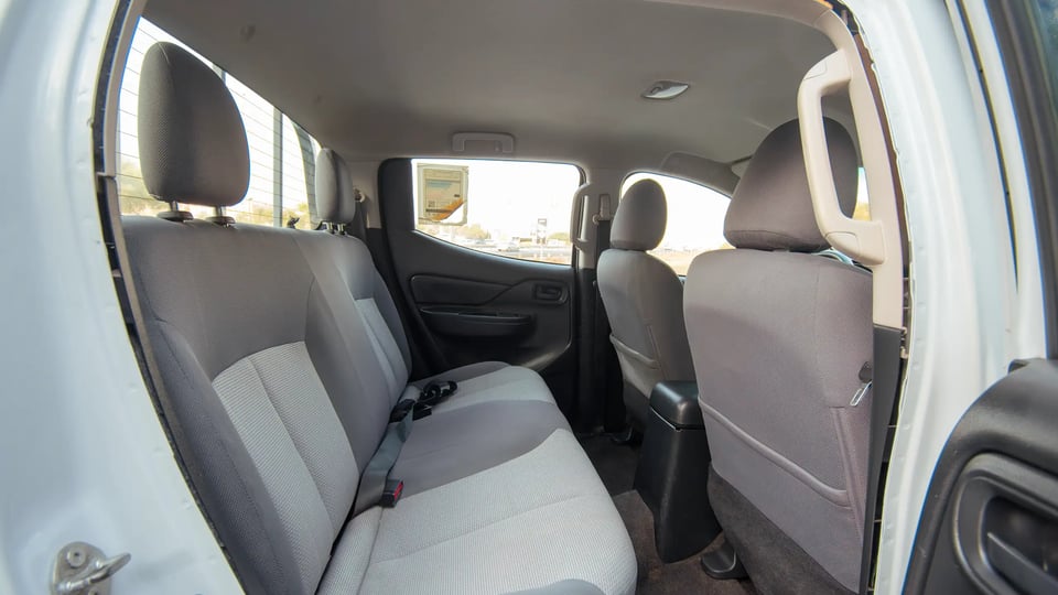 Used 2020 Mitsubishi L200 GLX Double Cabin White – Rear Passenger Side Cabin View at First Choice Cars Sharjah
