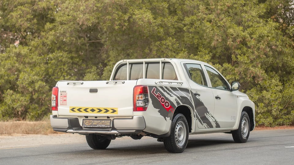 Used 2021 Mitsubishi L200 GL Double Cabin in White – Right Back Diagonal (45°) View for Sale at First Choice Cars Dubai Sharjah