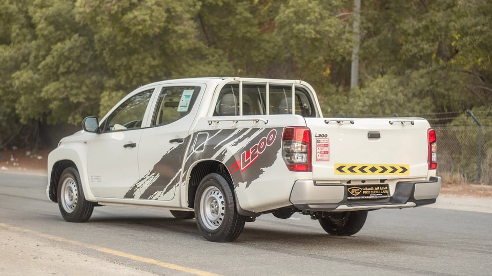 Used 2021 Mitsubishi L200 GL Double Cabin in White – Left Back Diagonal (45°) View for Sale at First Choice Cars Dubai Sharjah