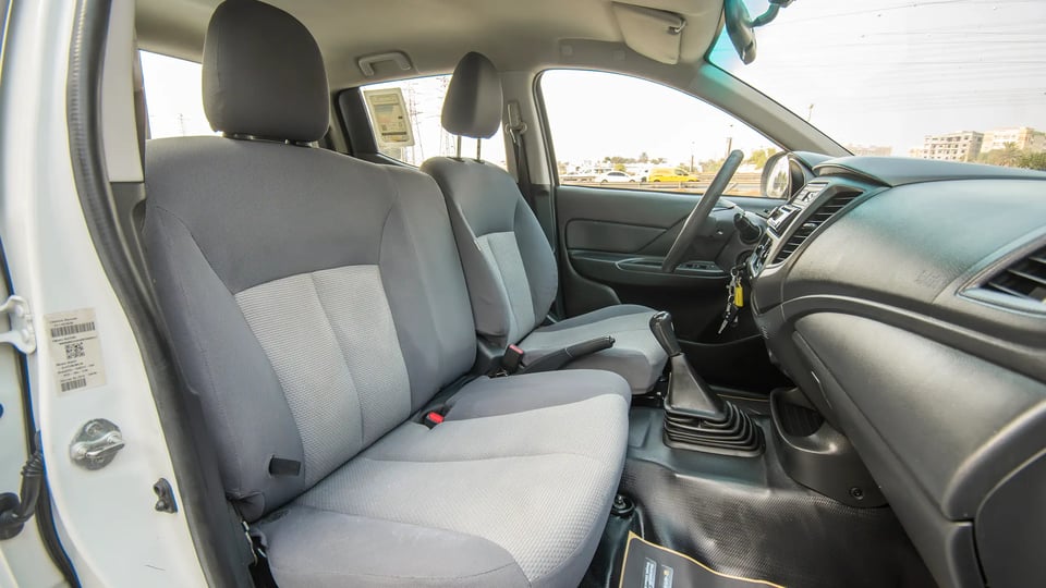 Used 2021 Mitsubishi L200 GL Double Cabin in White – Front Passenger Side Cabin View for Sale at First Choice Cars Dubai Sharjah